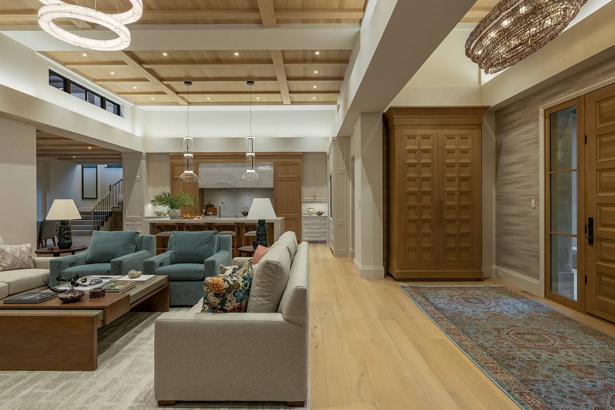 Great room with coffered ceiling and carved wood cabinet