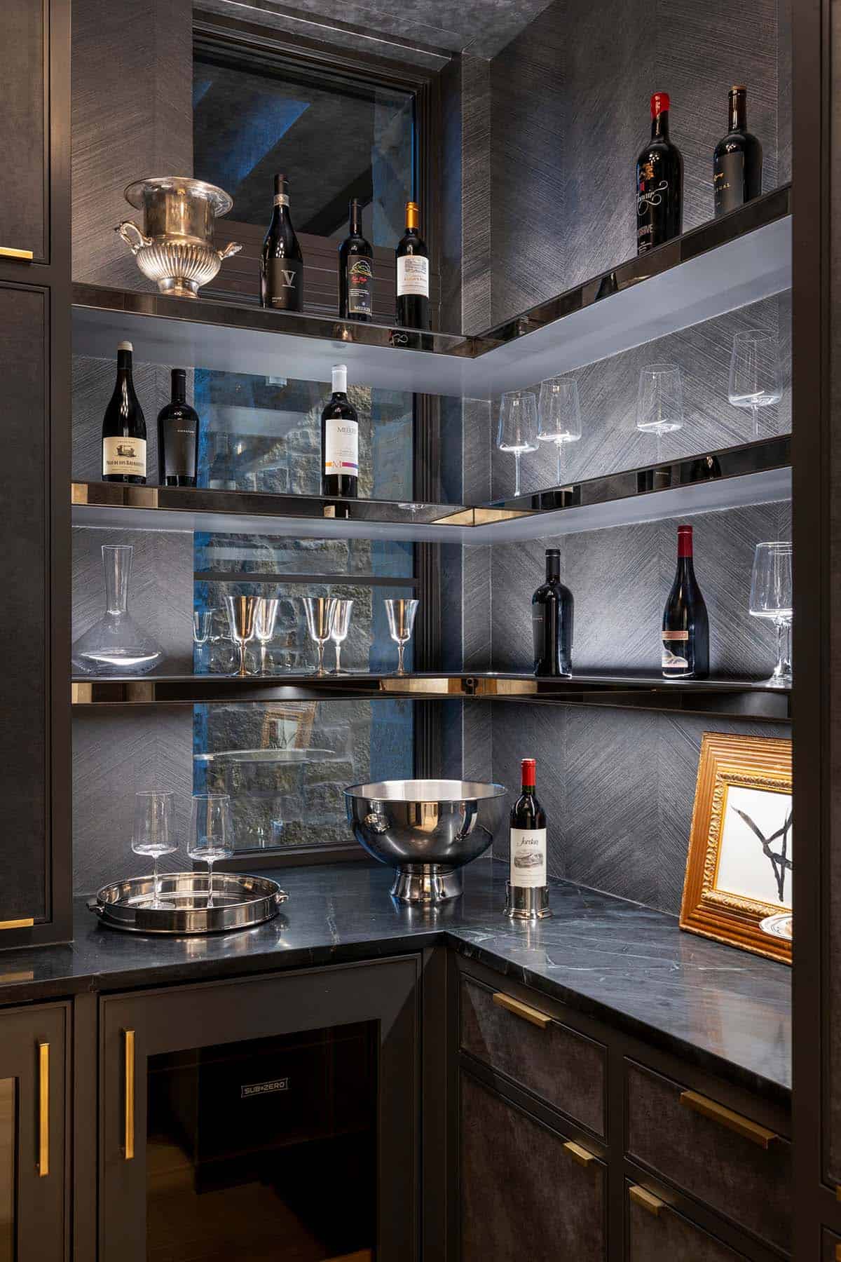 Corner wine bar shelving with glassware and mirrored backing