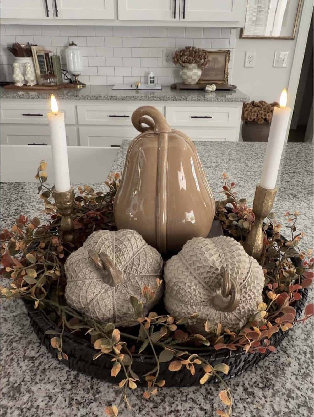 Round tray with pumpkins, garland and taper candlesticks