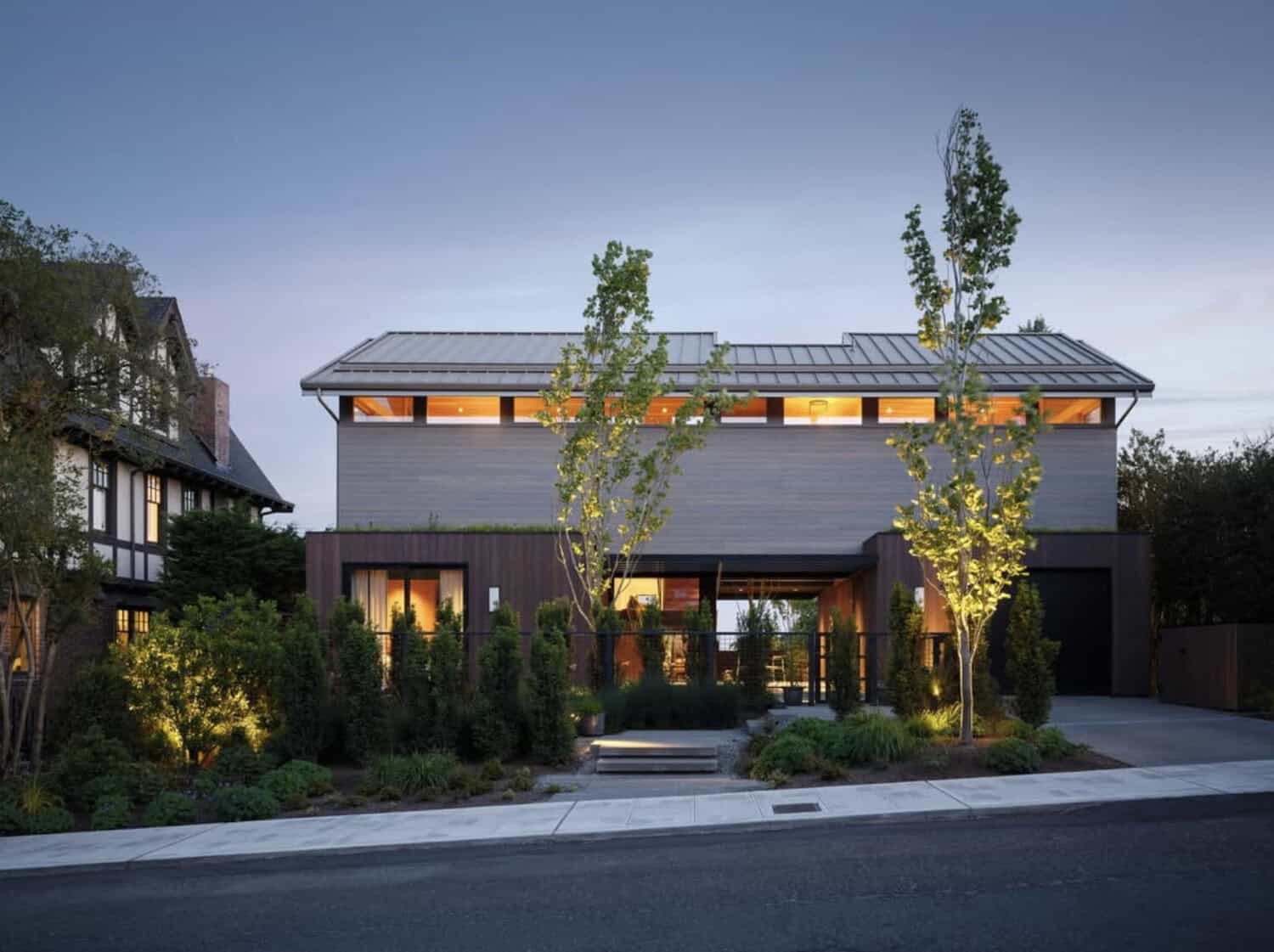 Exterior of wood-clad home at twilight