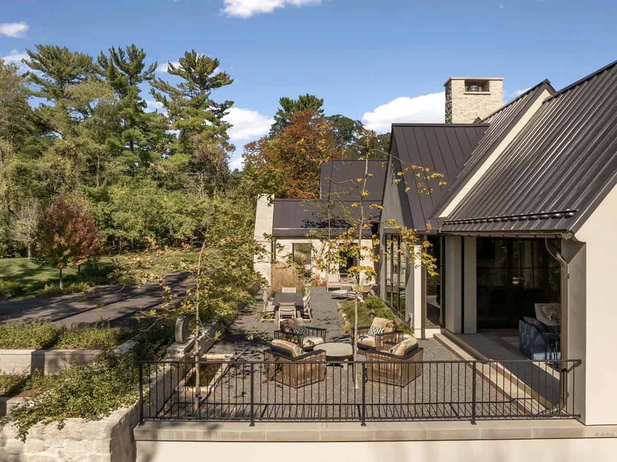 Aerial view of gravel terrace with fire pit and chimney