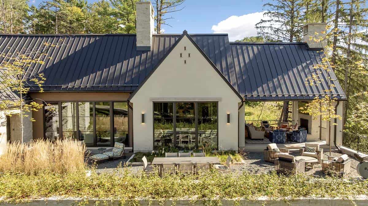 Rear exterior with covered porch and gabled glass window wall