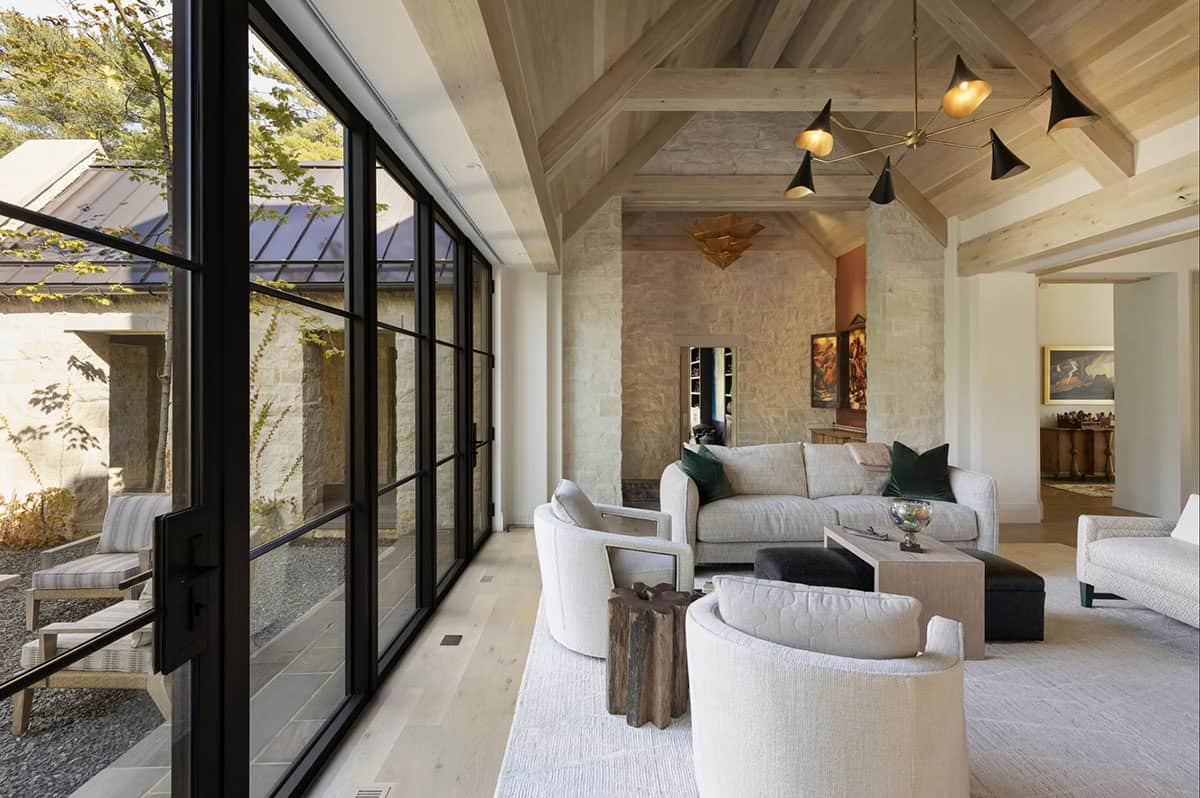 Living room with glass doors and colorful woven wall art