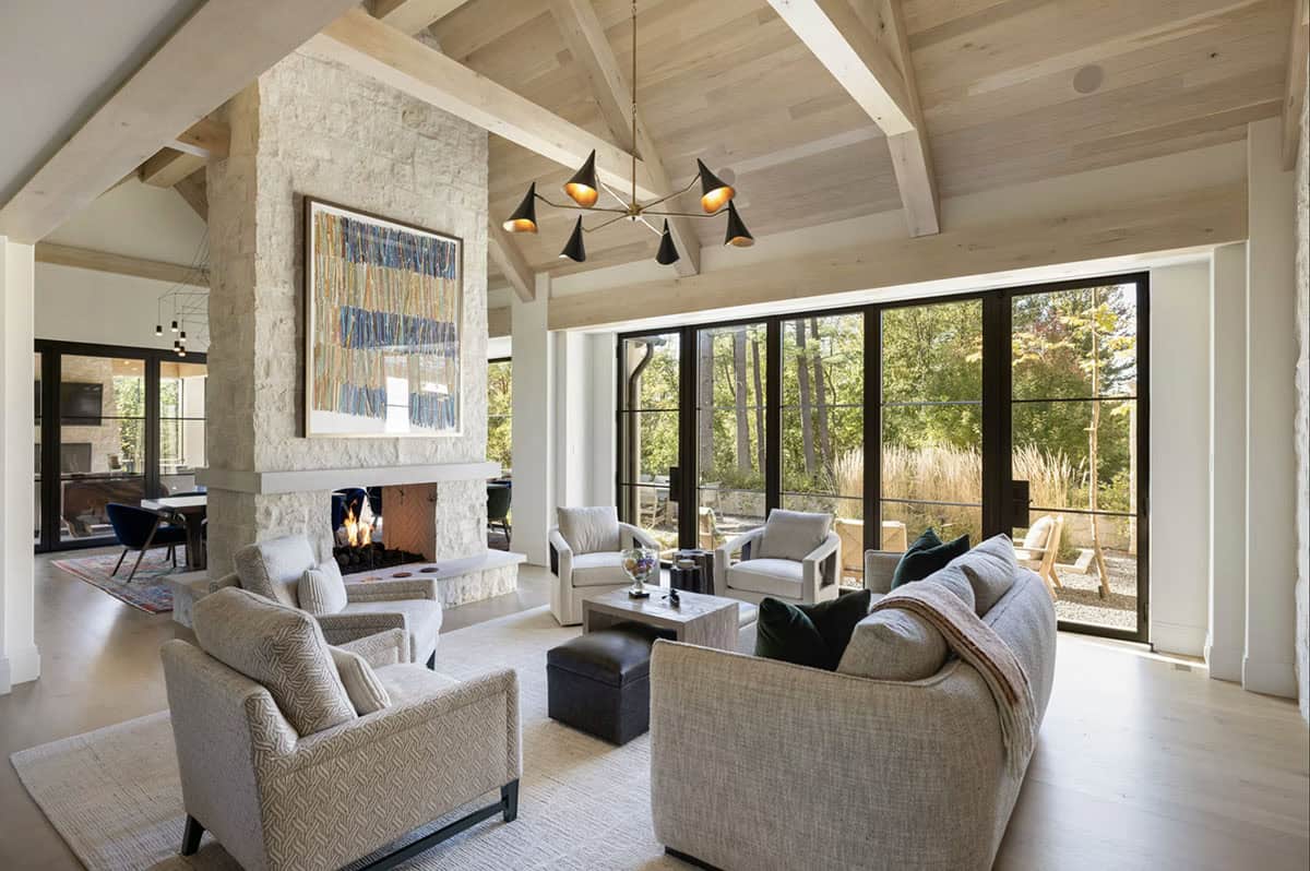 Living room with glass doors leading out to stone patio