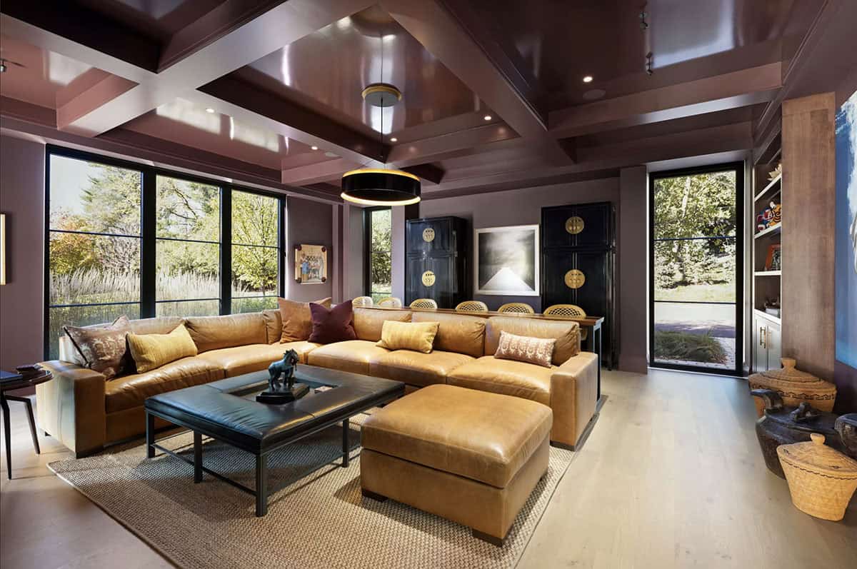 Media room with leather sectional and coffered mahogany ceiling