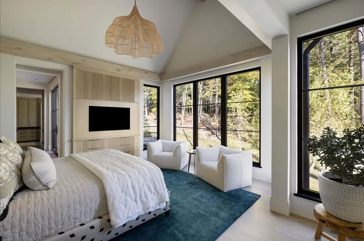 Bedroom with woven pendant light and teal area rug