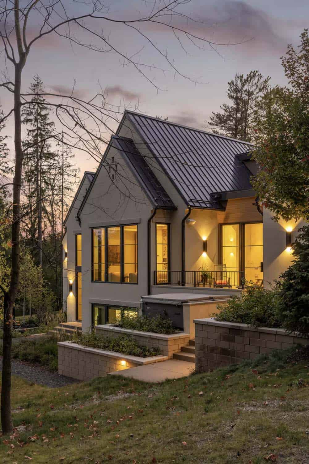 Dusk view of gabled addition with hot tub and steps