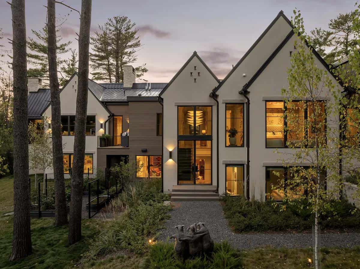 Dusk aerial view of illuminated gables and wood siding accent