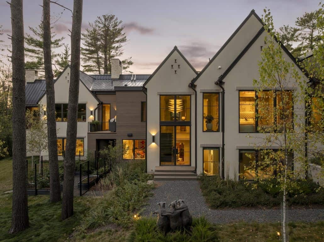 Dusk exterior with birch trees and gravel garden bed