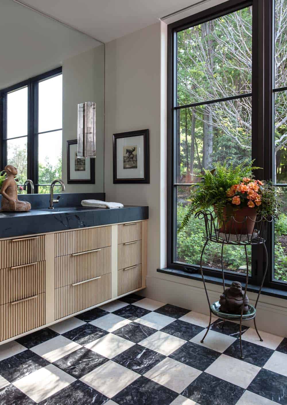 Bathroom with checkerboard marble floor and fluted wood vanity