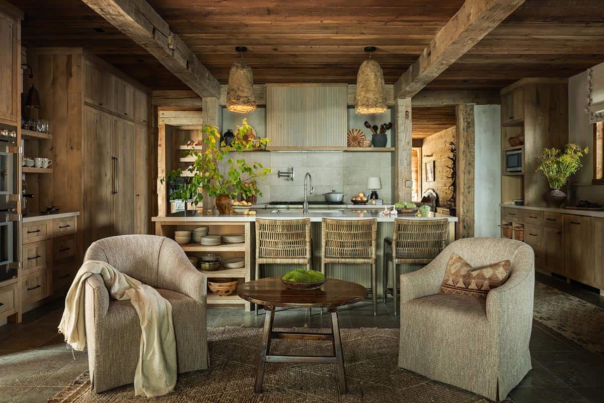 Rustic kitchen with oak cabinets, textured pendants, and two swivel chairs