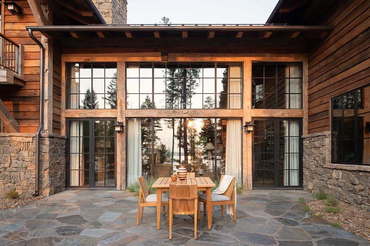 Courtyard patio with teak dining set and steel-framed windows