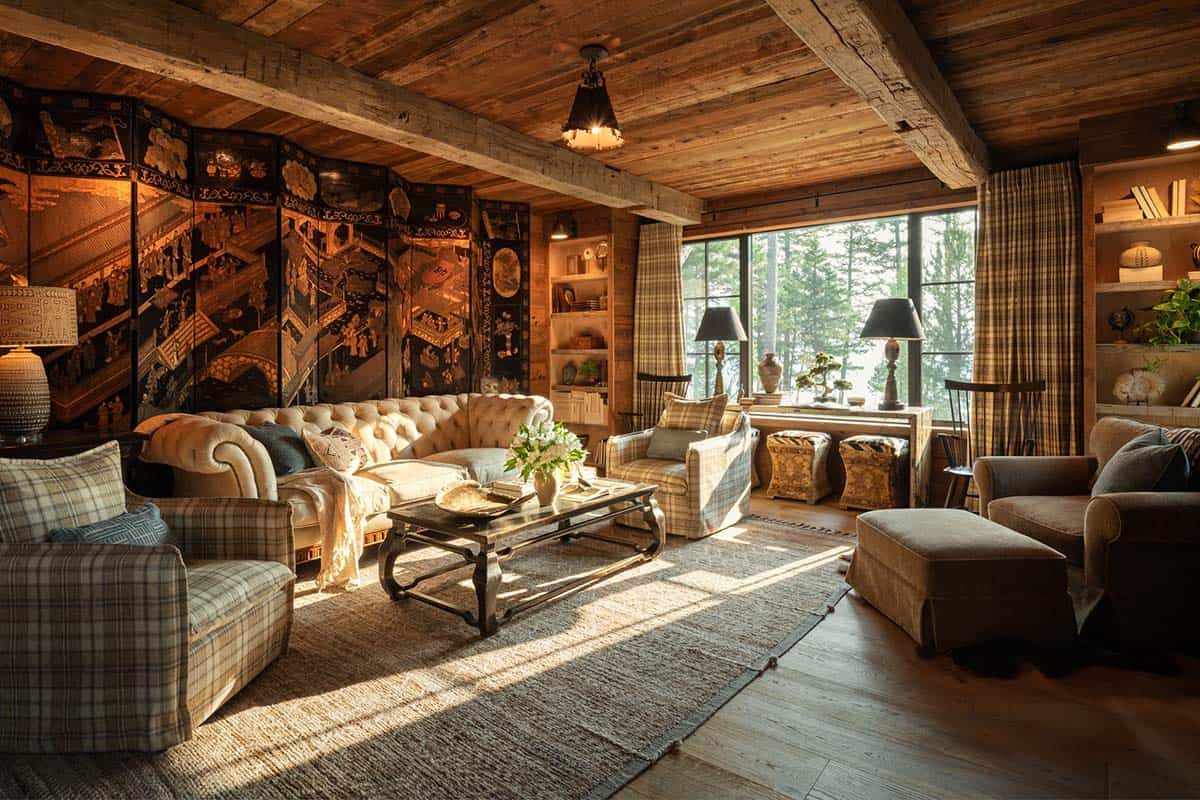 Lounge with antique lacquer screen, tufted sofa, and plaid chairs