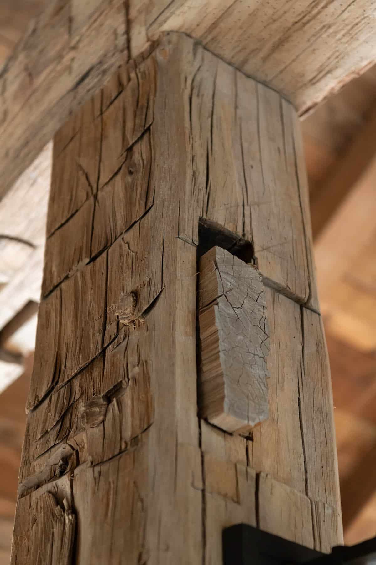 Timber post with exposed mortise and tenon joinery