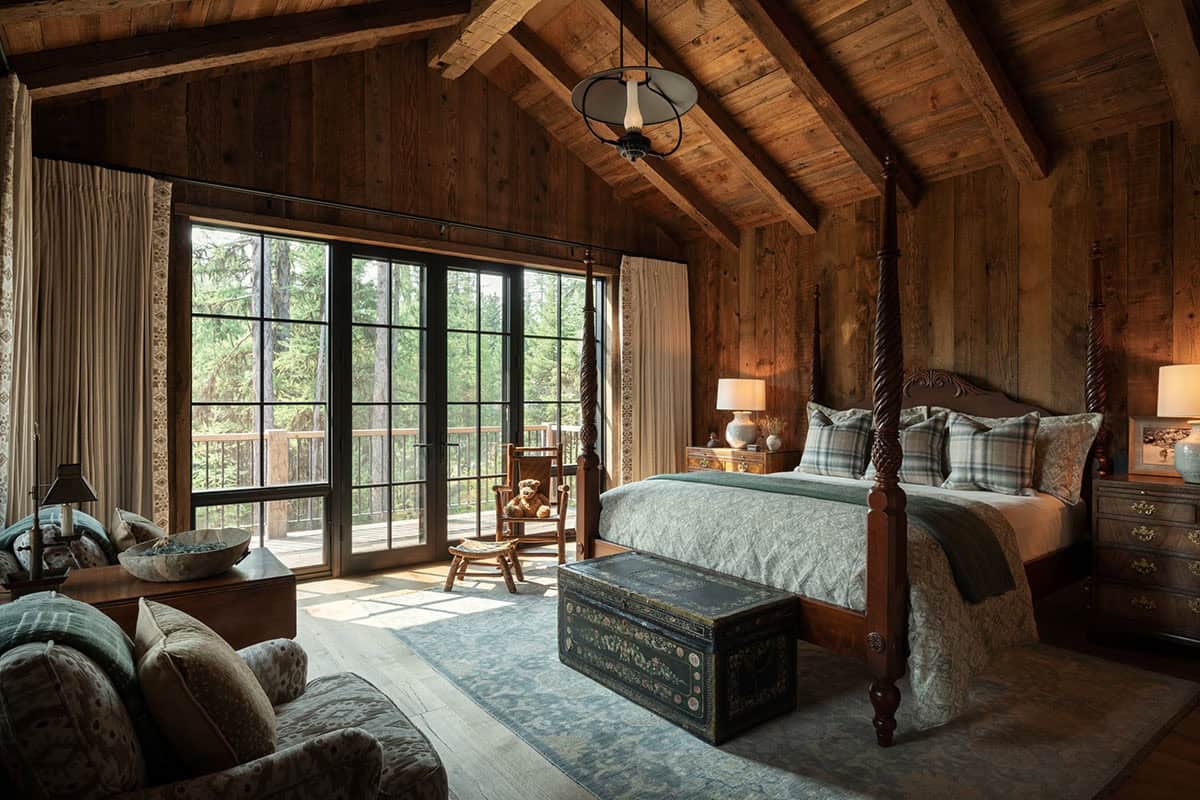 Guest bedroom with four-poster bed and painted trunk