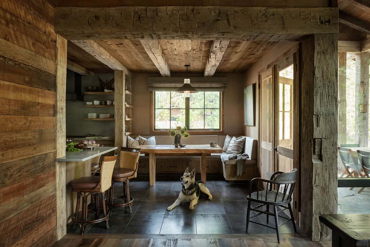 Guest cabin breakfast nook with a German shepherd on the floor