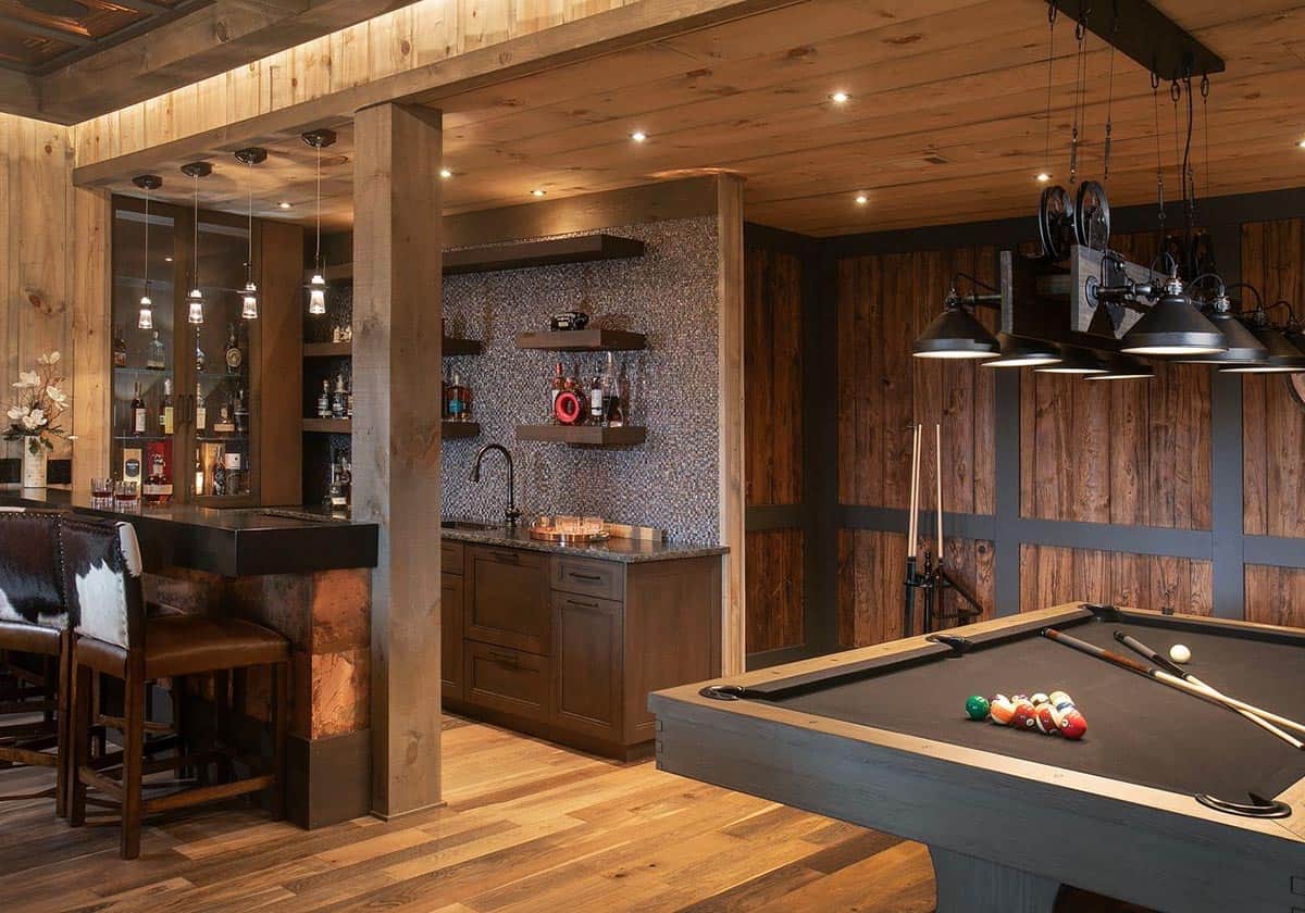 Terrace level bar next to a pool table with wood paneled walls