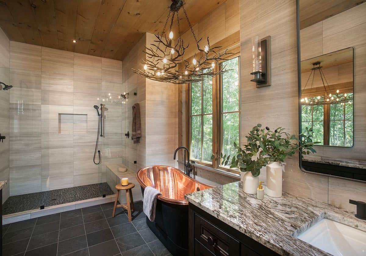 Primary bathroom with copper soaking tub, walk-in shower and branch chandelier