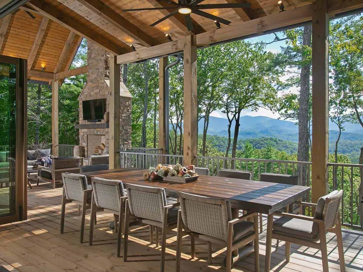 Covered dining porch with long table and Blue Ridge Mountain views