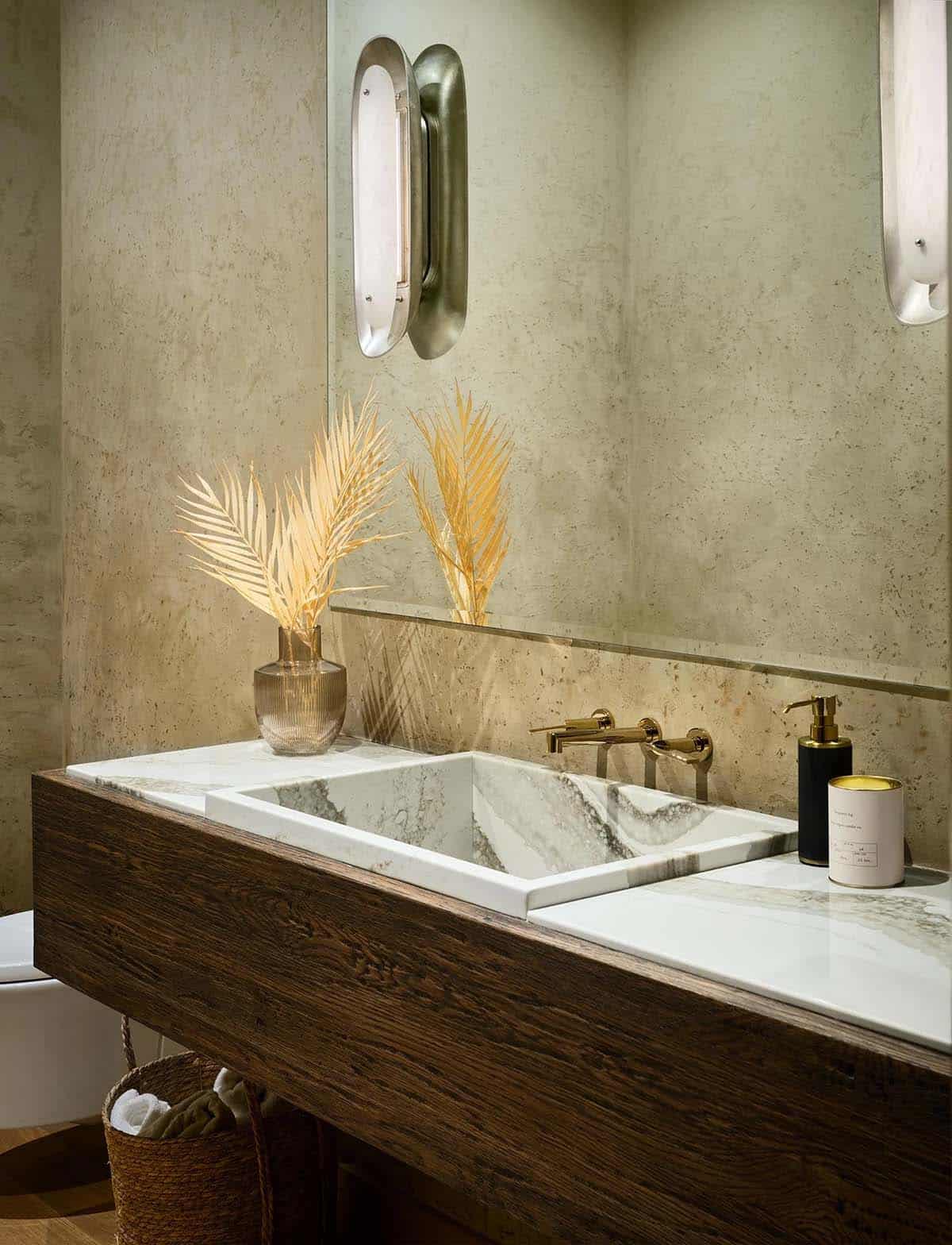 Powder room with a marble sink on a dark oak floating vanity