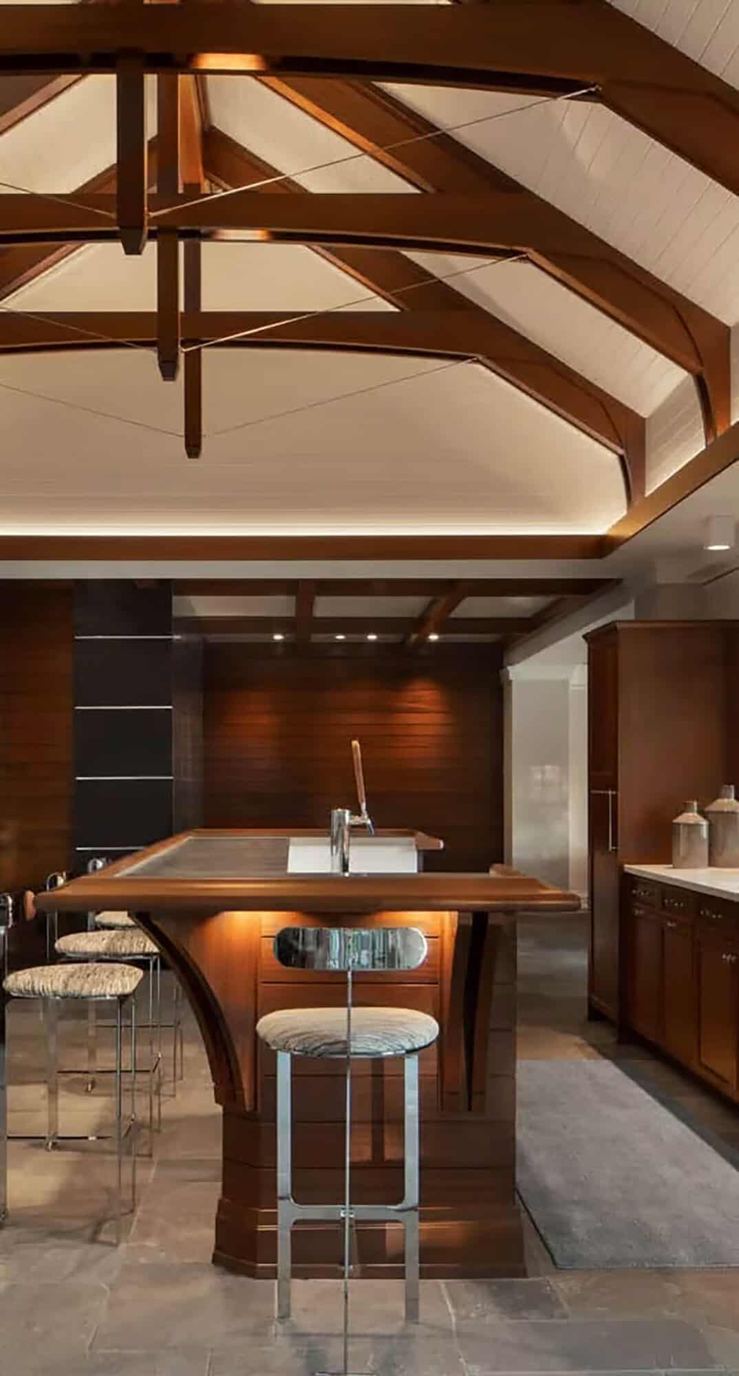 Boathouse bar with wood island, chrome stools and white trussed ceiling