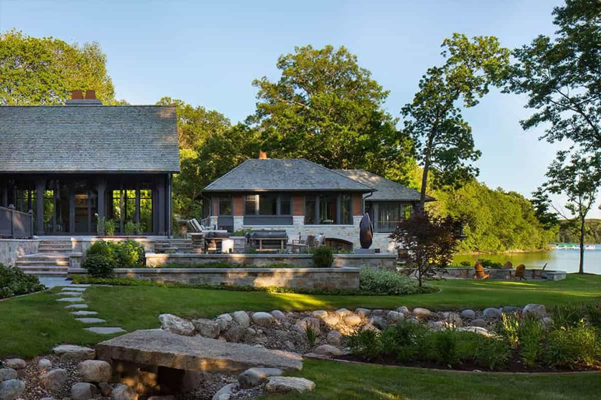 Lawn and stone terraces between the lake pavilion and boathouse