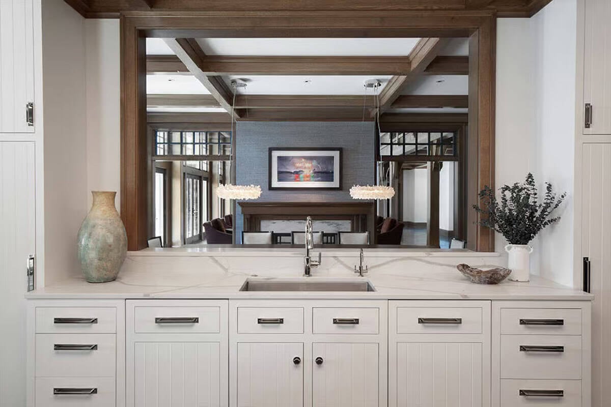 Kitchen sink with pass-through opening to the dining room
