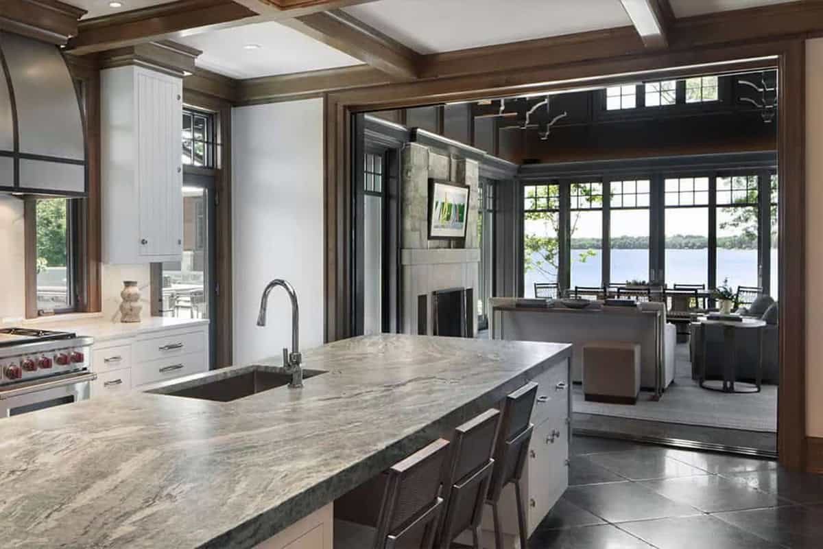 Kitchen island looking into the lake pavilion with water views