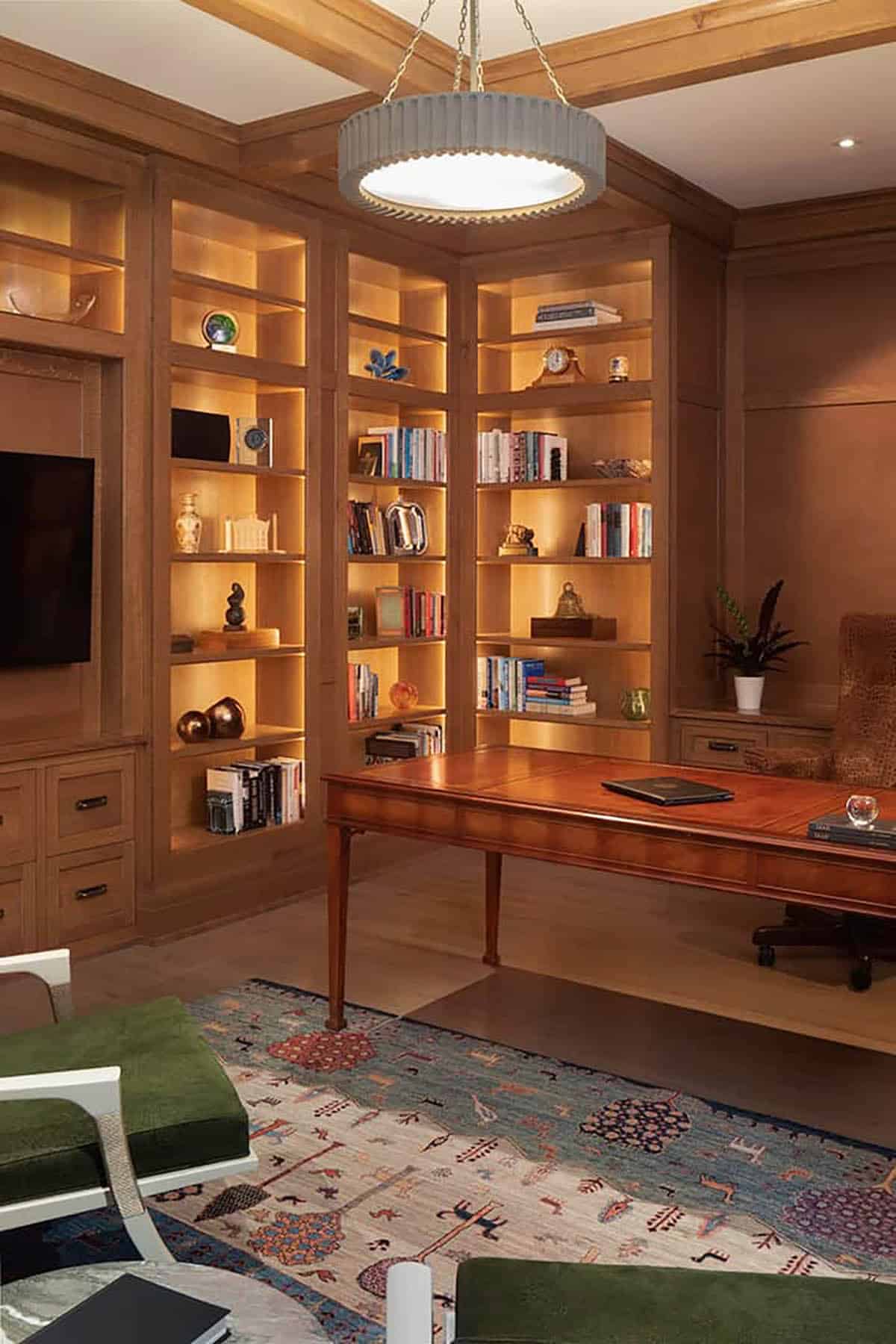 Corner bookshelves with backlighting and leather-top desk