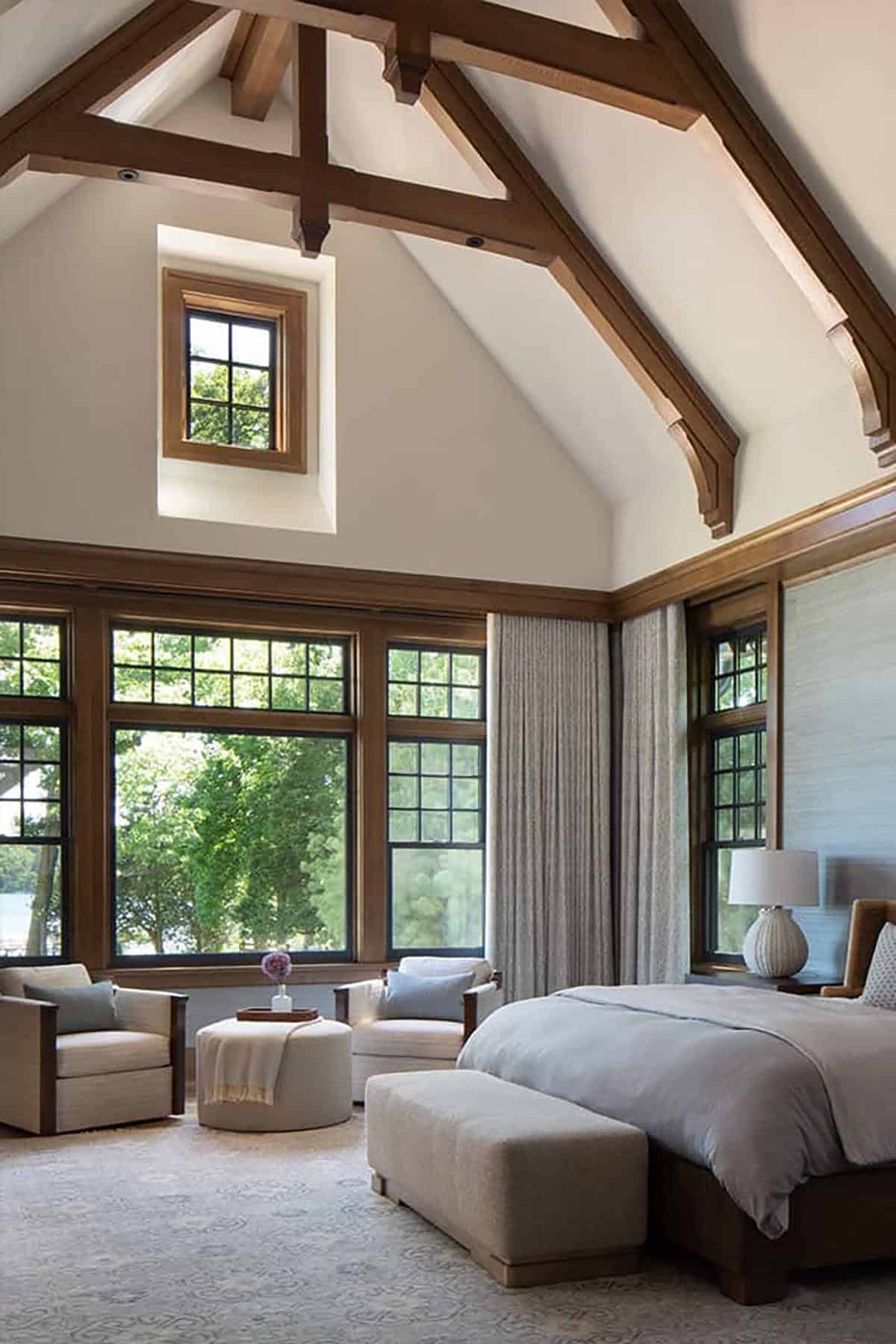 Owner's bedroom with vaulted ceiling, timber trusses and sitting area