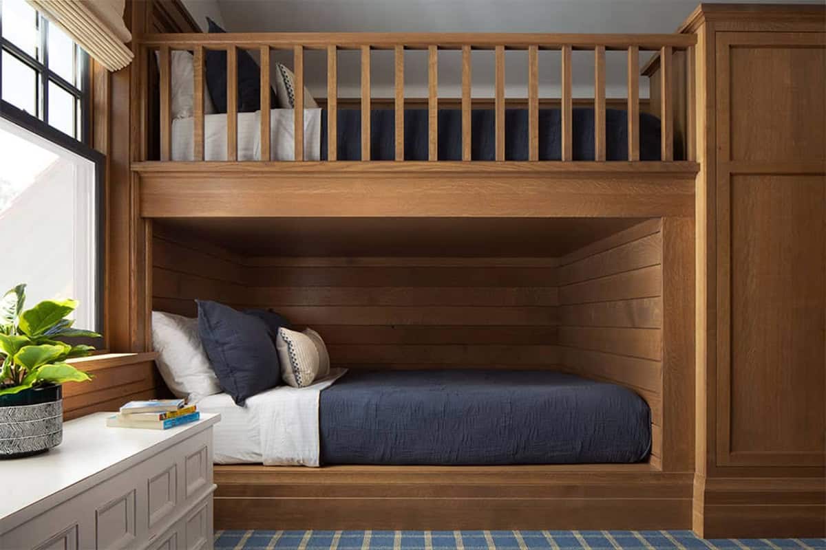 Built-in oak bunk beds with navy bedding
