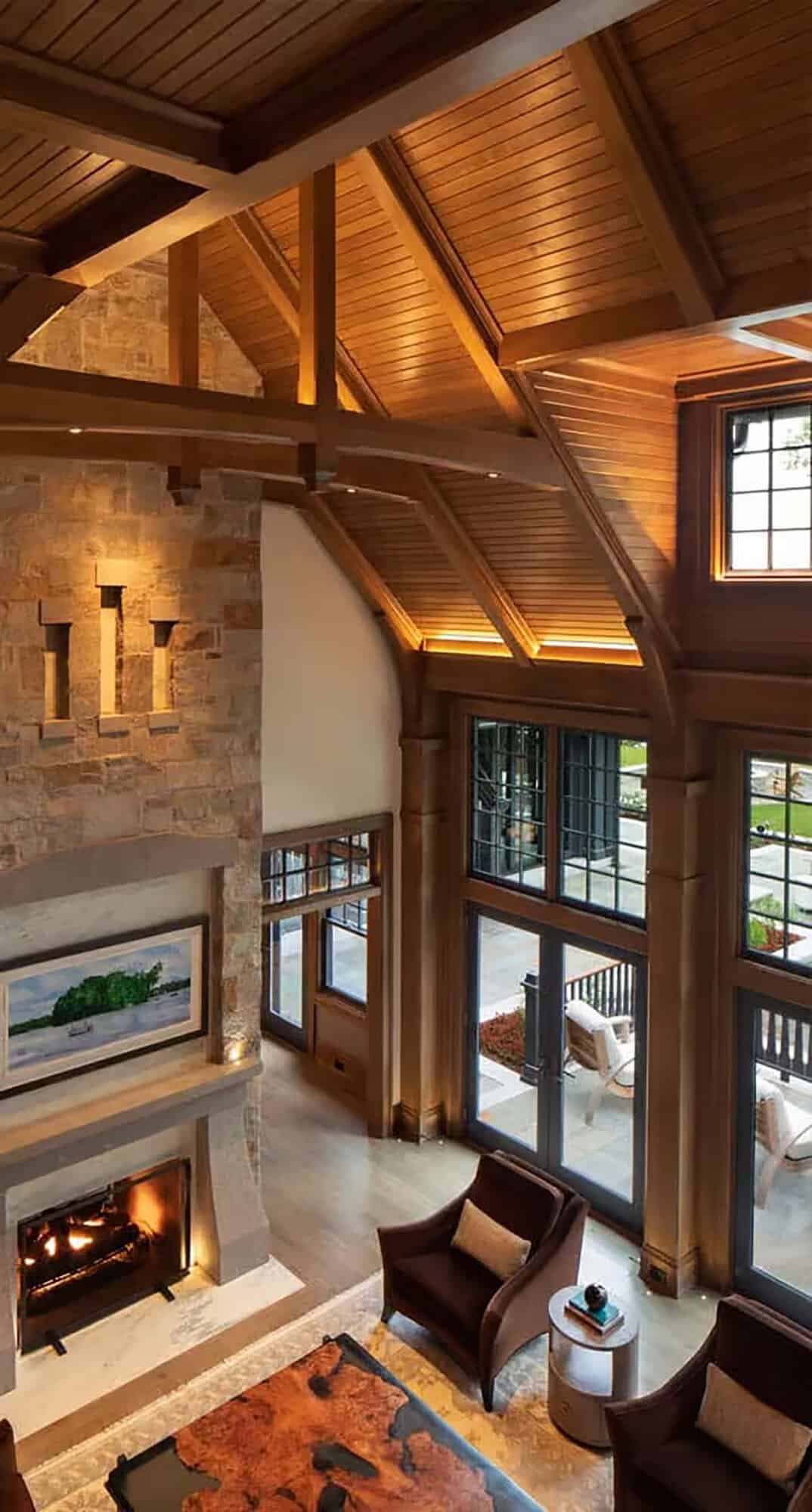 Great room with stone fireplace and wood ceiling seen from above