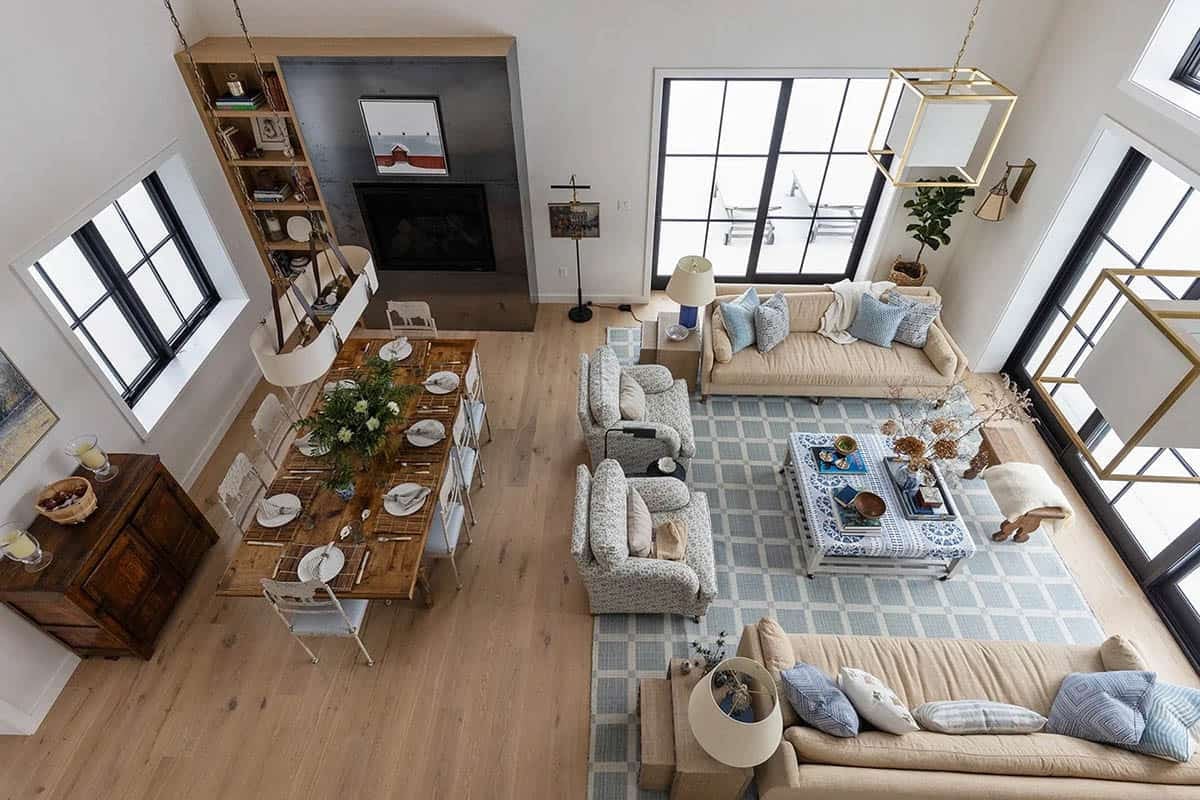 Overhead view of the dining table, seating area and patterned blue rug