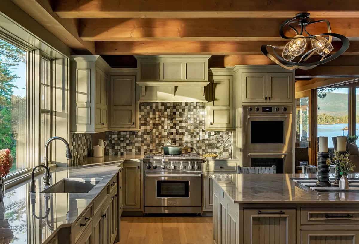 Kitchen range wall with mosaic tile backsplash, stainless steel range, and double wall ovens