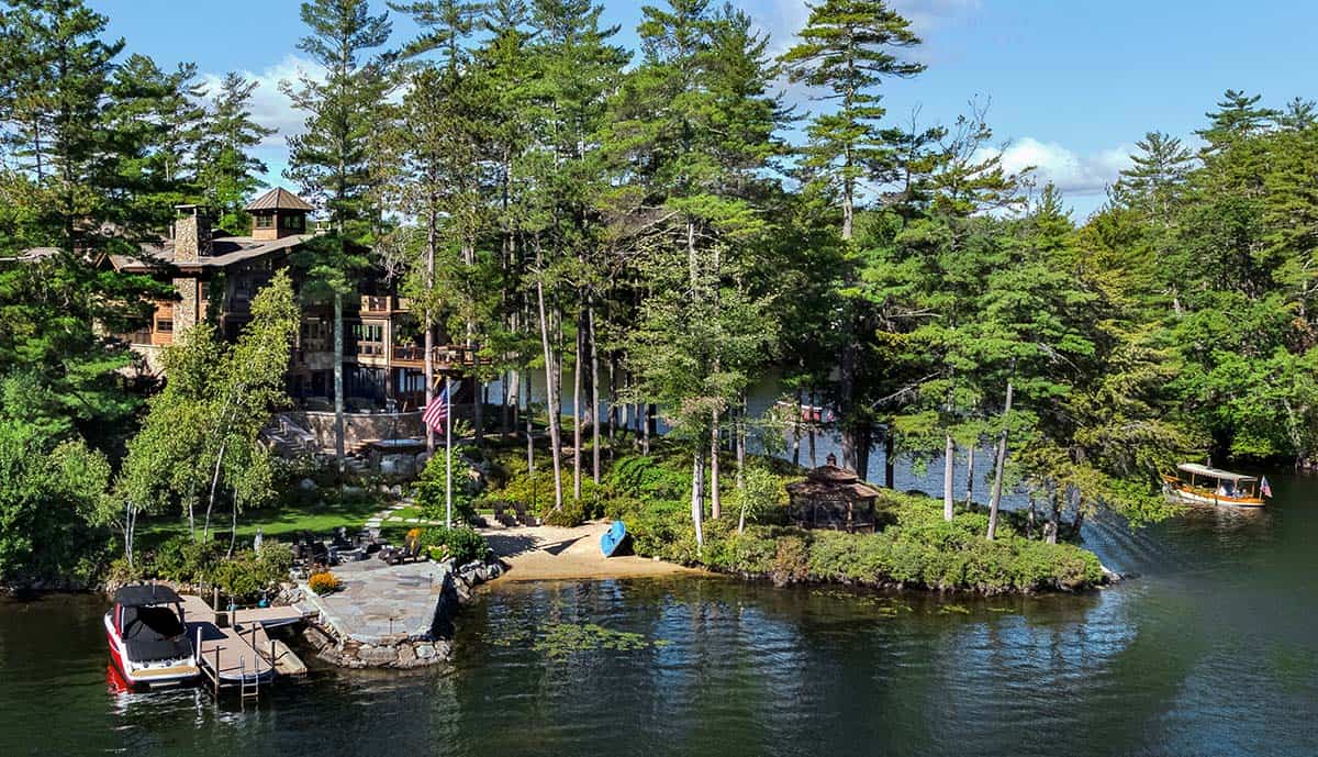 A sprawling waterfront lodge surrounded by pine trees on Lake Winnipesaukee, New Hampshire