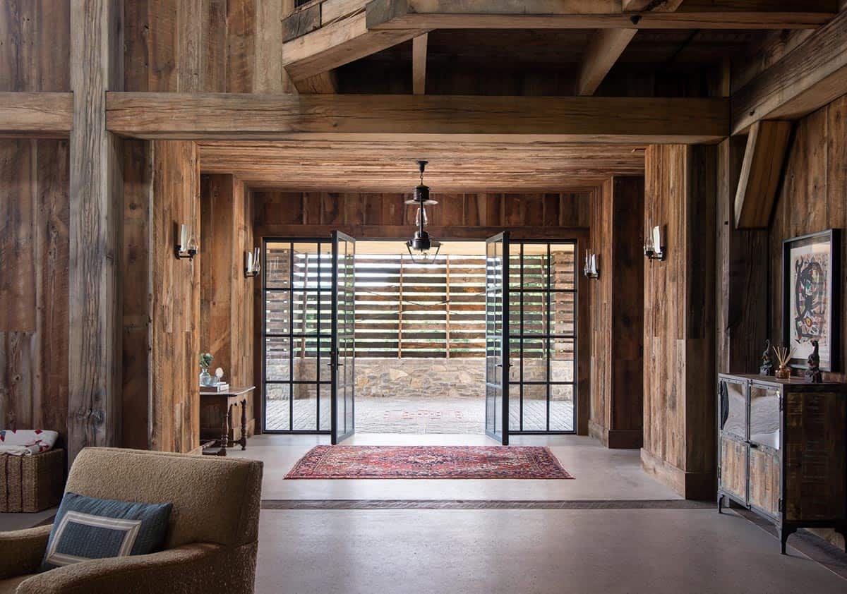 Entry hall with steel doors open to slatted breezeway