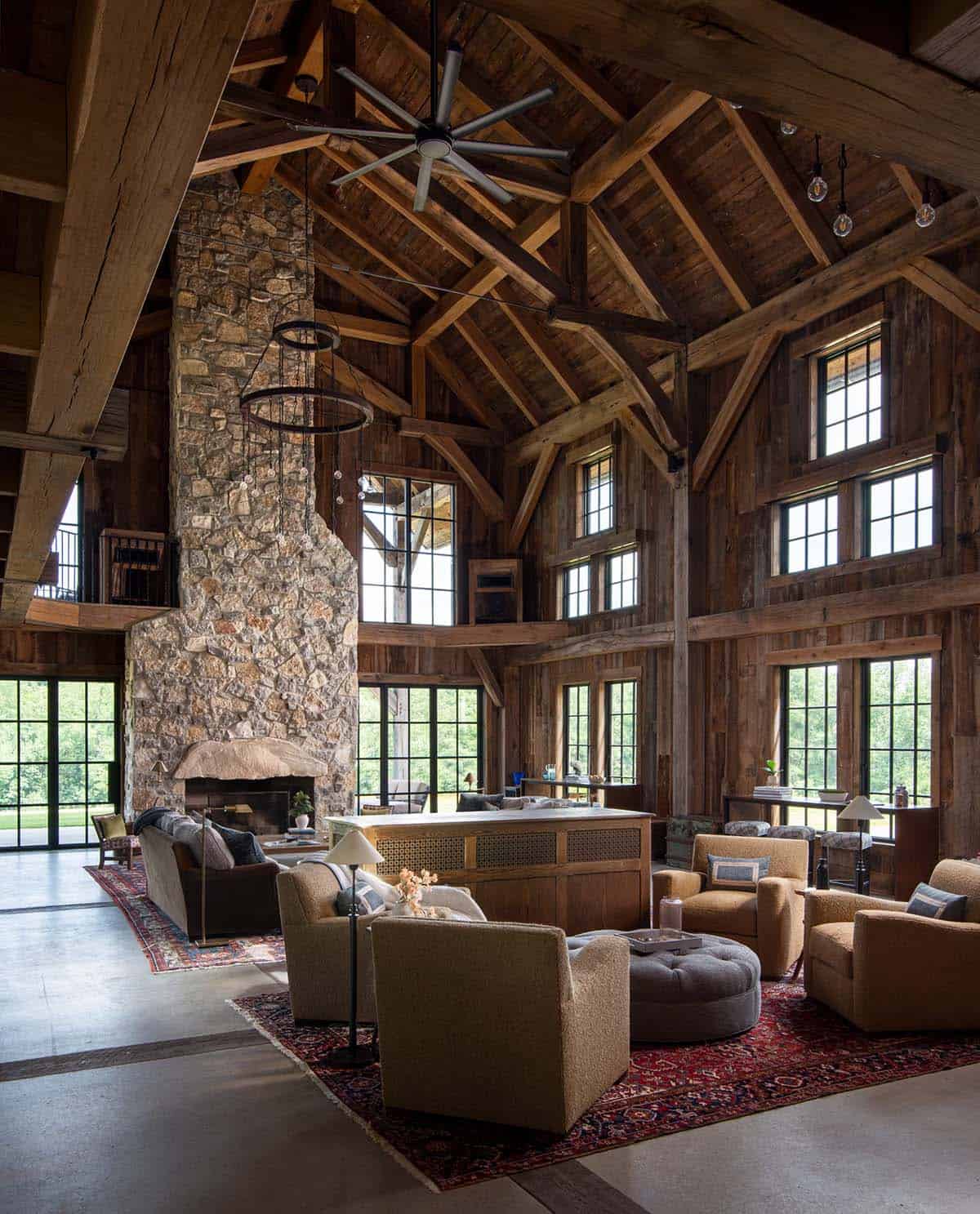 Great room with boucle swivel chairs and stone fireplace