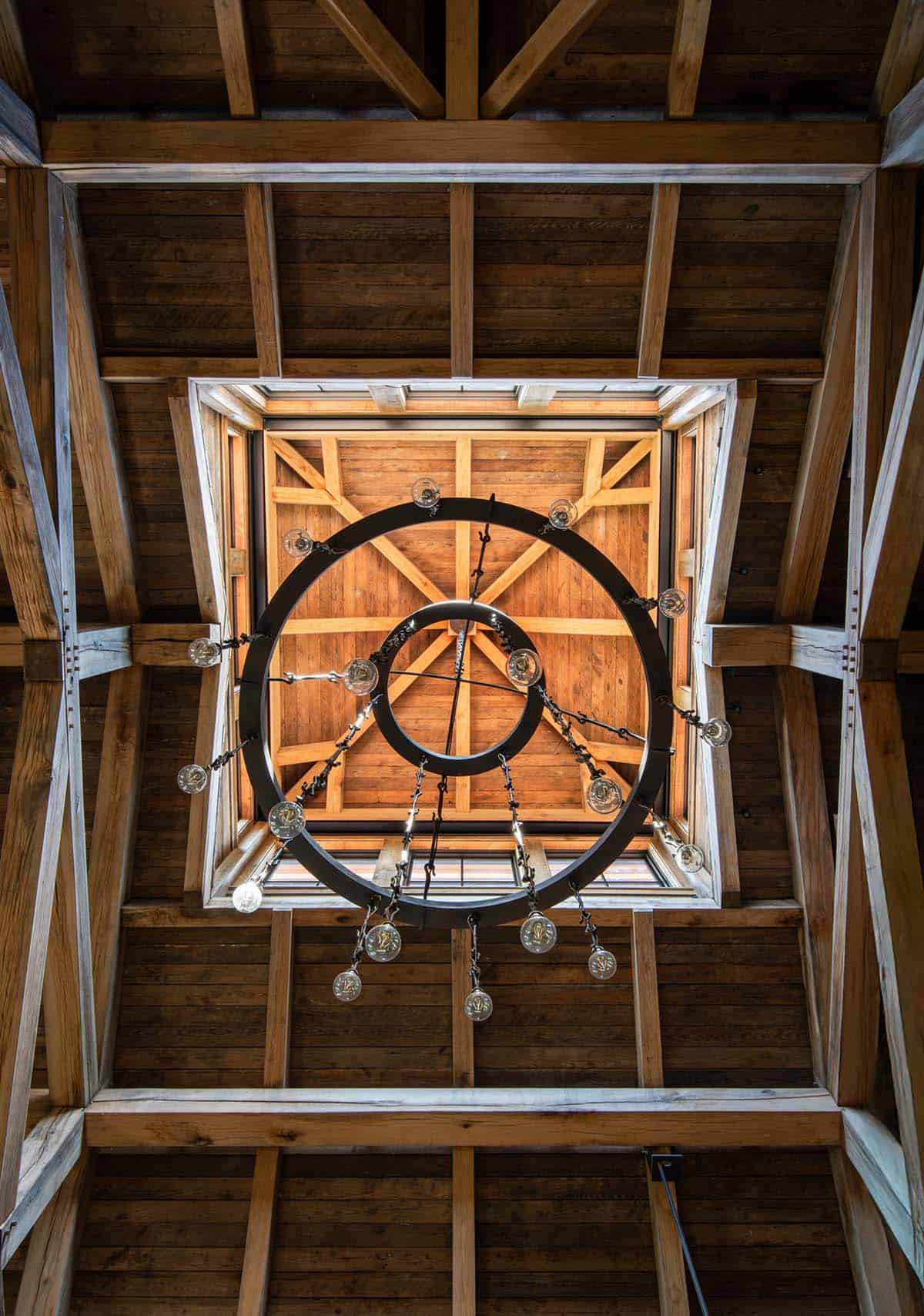 Looking up through iron ring chandelier into the cupola
