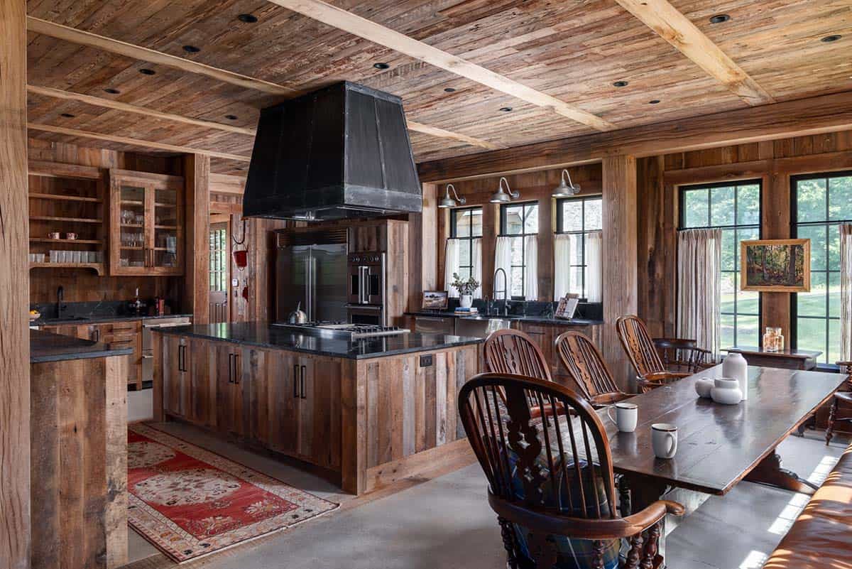 Kitchen with blackened steel hood, soapstone island, and Windsor chairs