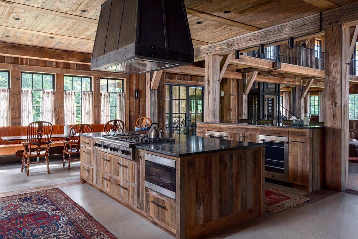 Reclaimed wood kitchen island with gas range and steel hood