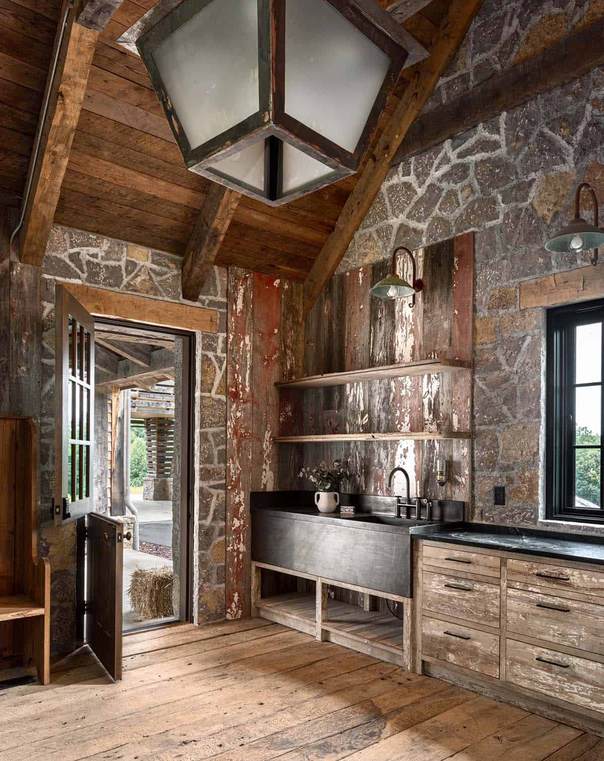 Stone-walled mudroom with Dutch door and soapstone utility sink