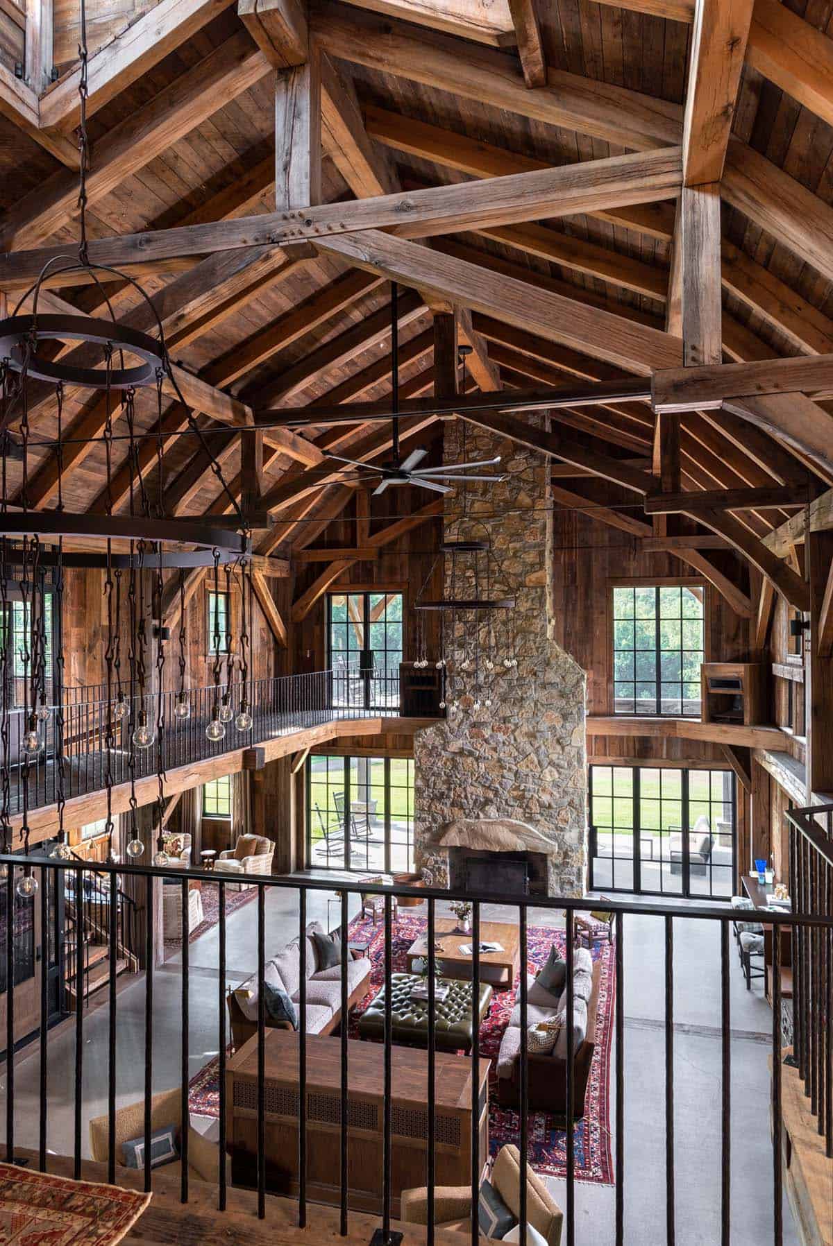 View from loft down into great room with stone fireplace