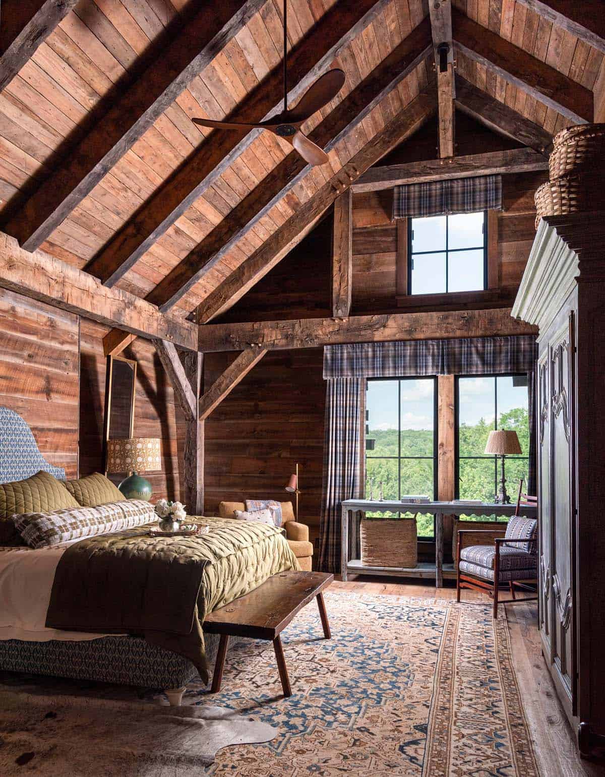 Vaulted bedroom with plaid valances and treetop views
