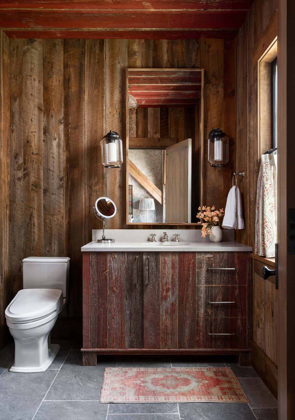 Bathroom with red-washed barnwood vanity and bluestone floor