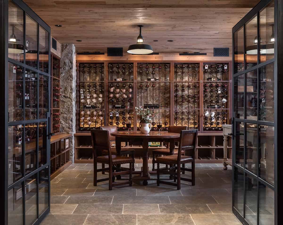 Wine cellar with iron bottle racks and round tasting table