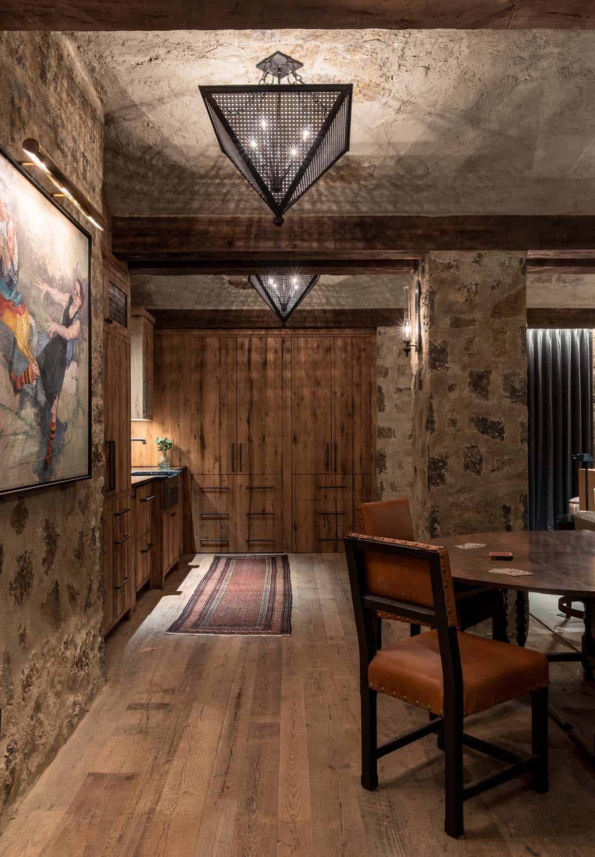 Game room with card table and pierced metal pyramid pendants