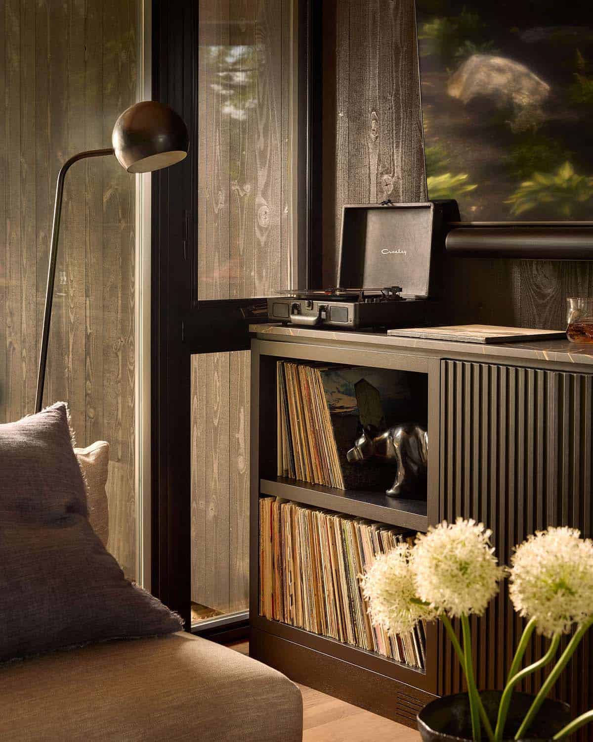 Record console with turntable and globe floor lamp