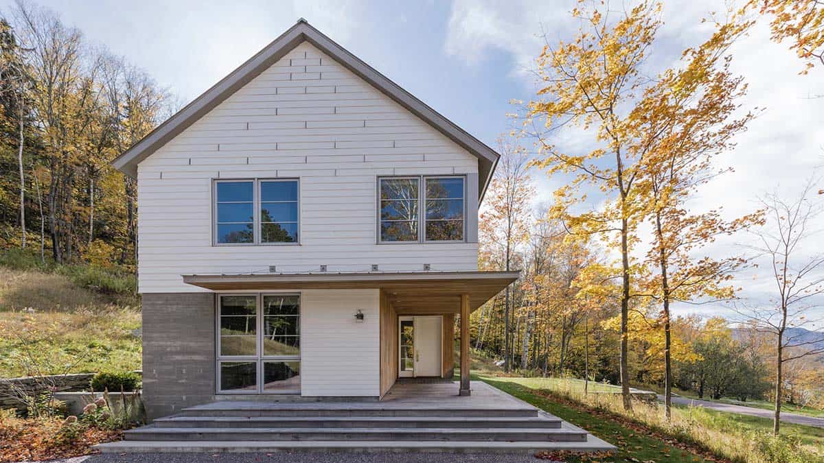 Front entry with timber canopy, wide concrete steps and hardiplank siding