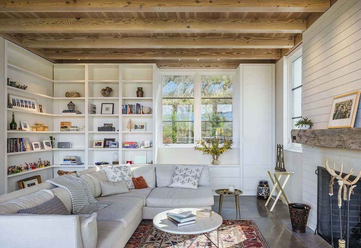 Cozy sitting area with built-in white shelving and a corner sectional