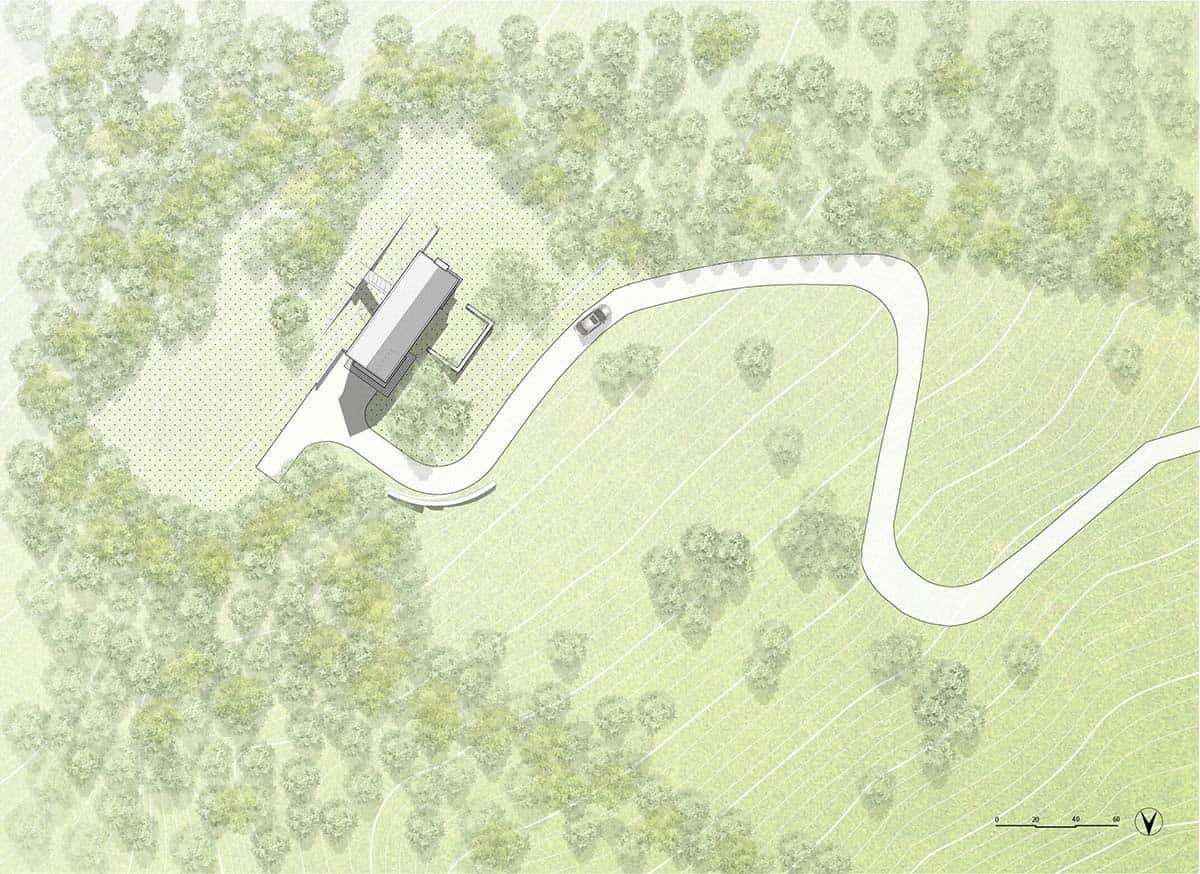 Site plan of the home on a wooded hillside with a winding driveway